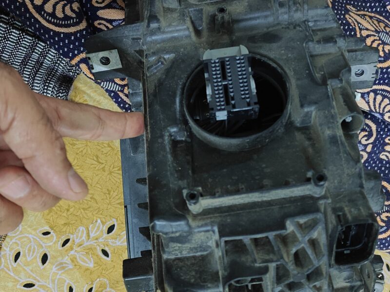 Used BMW 320d front headlight assembly with broken glass